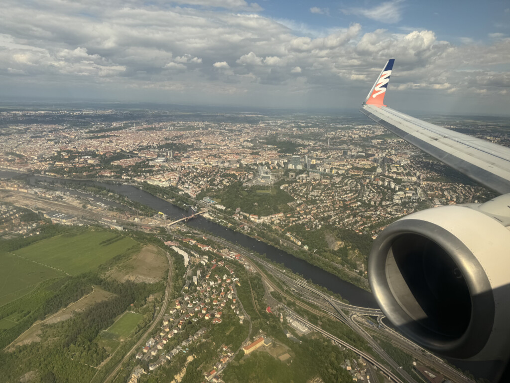 an airplane wing and a river in the sky