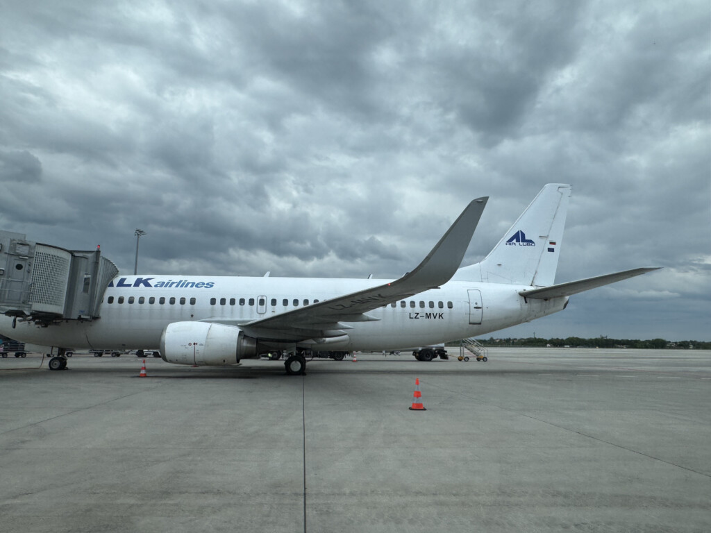 a white airplane on a runway