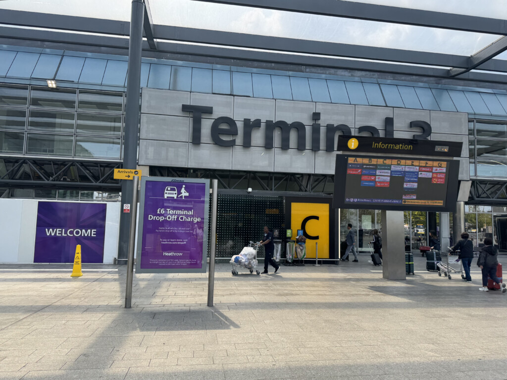 a sign board in front of a building