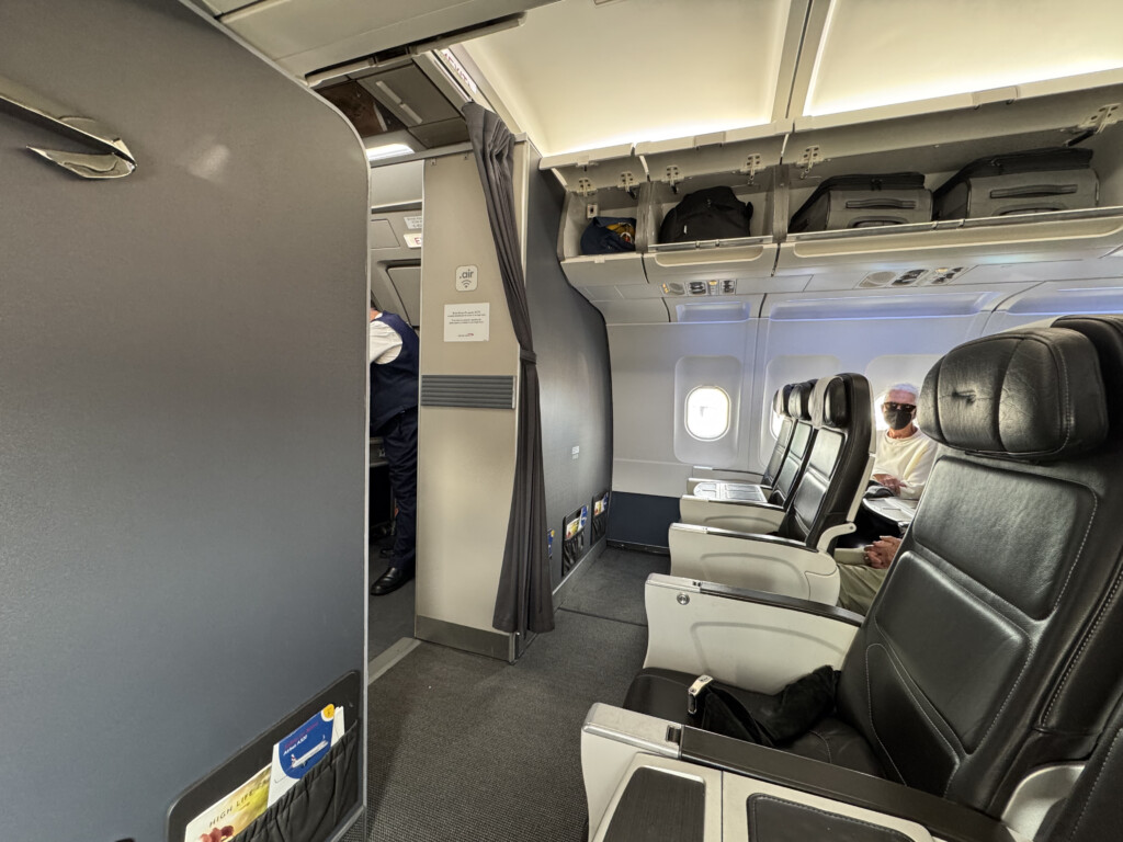 an airplane with seats and people in the back