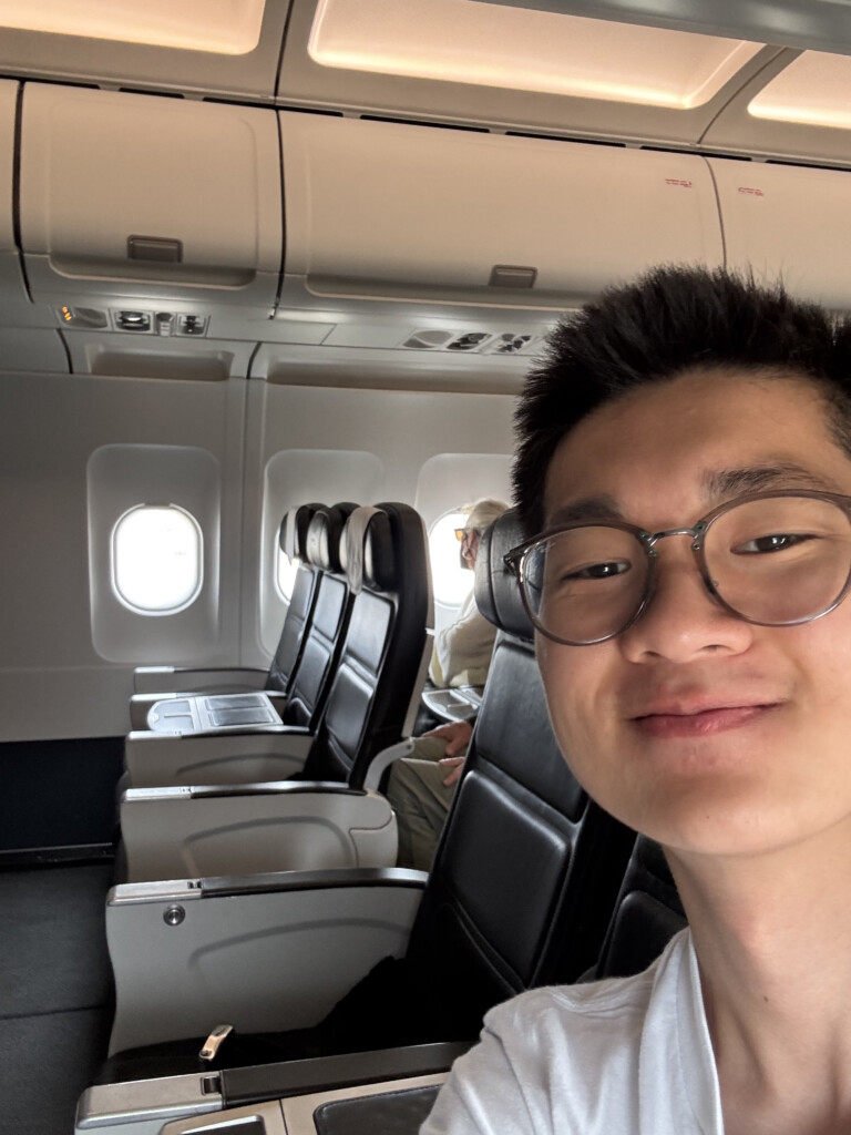 a man taking a selfie in an airplane