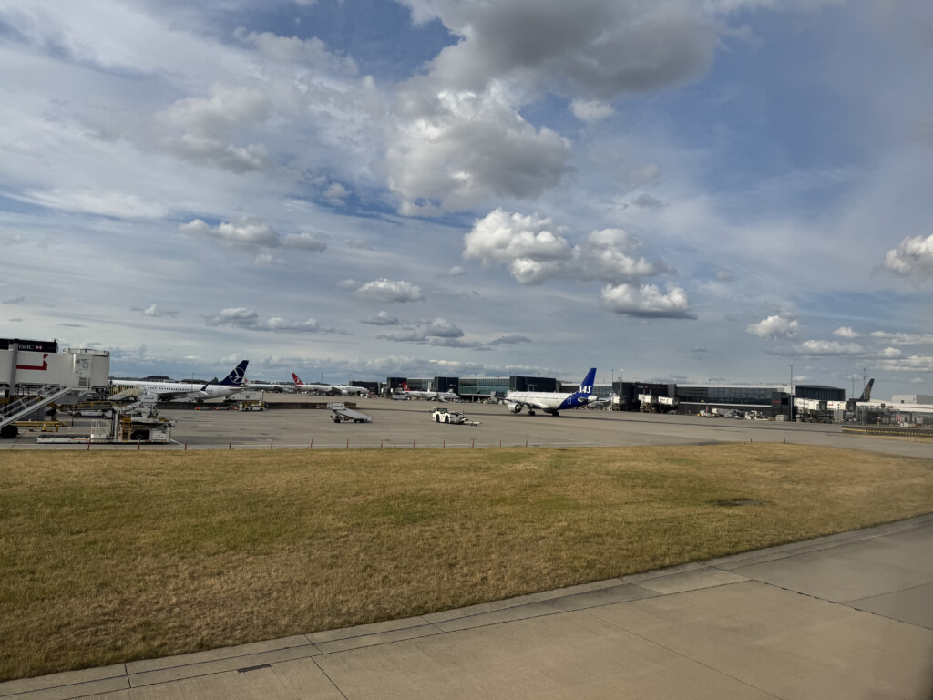 an airport with airplanes on the ground