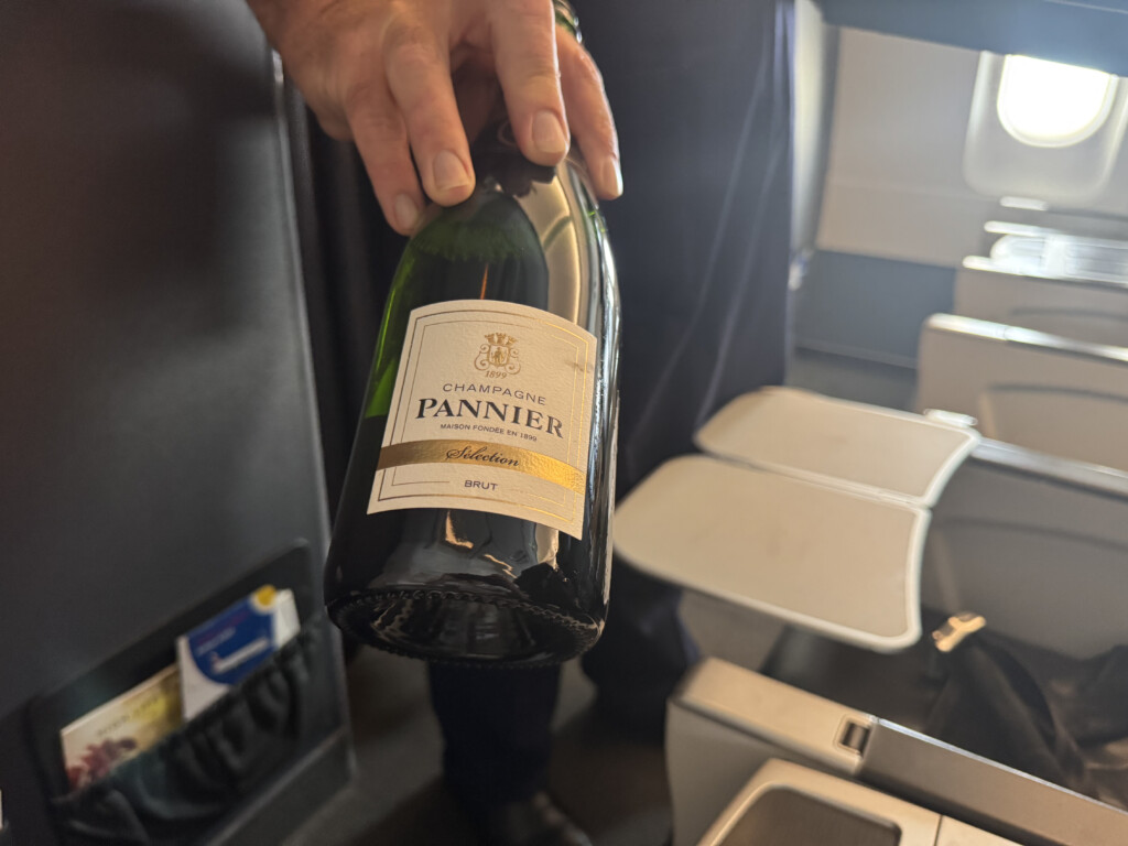 a person holding a bottle of wine