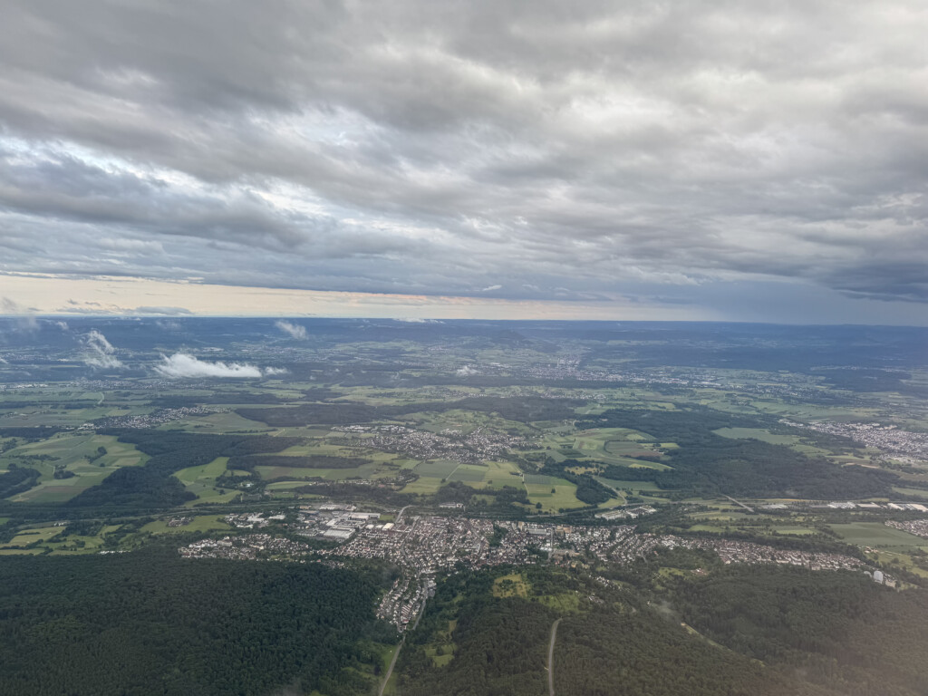 aerial view of a city and a forest