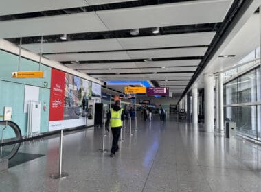 a person in a yellow vest standing in a hallway