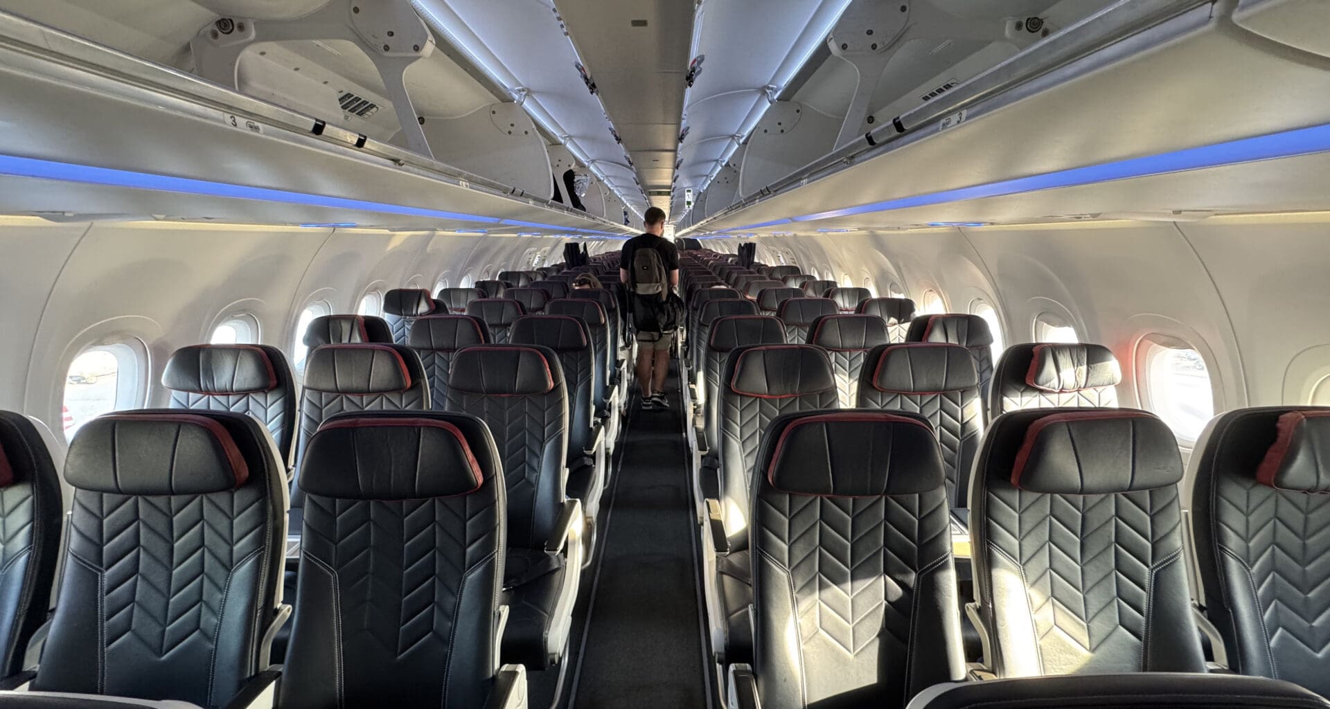 a person standing in the middle of an airplane