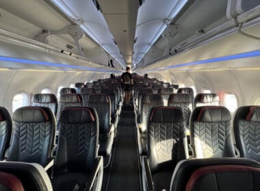 a person standing in the middle of an airplane