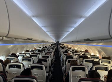 a group of people sitting in an airplane