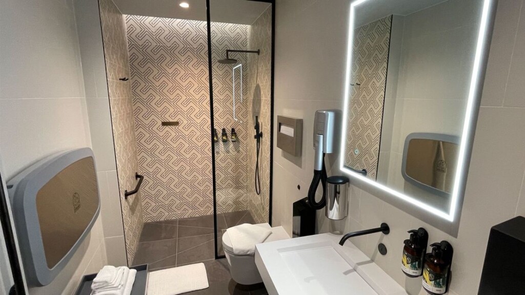 a bathroom with a mirror and sink