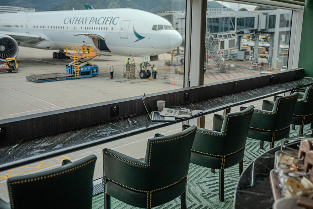 a window with a plane in the background