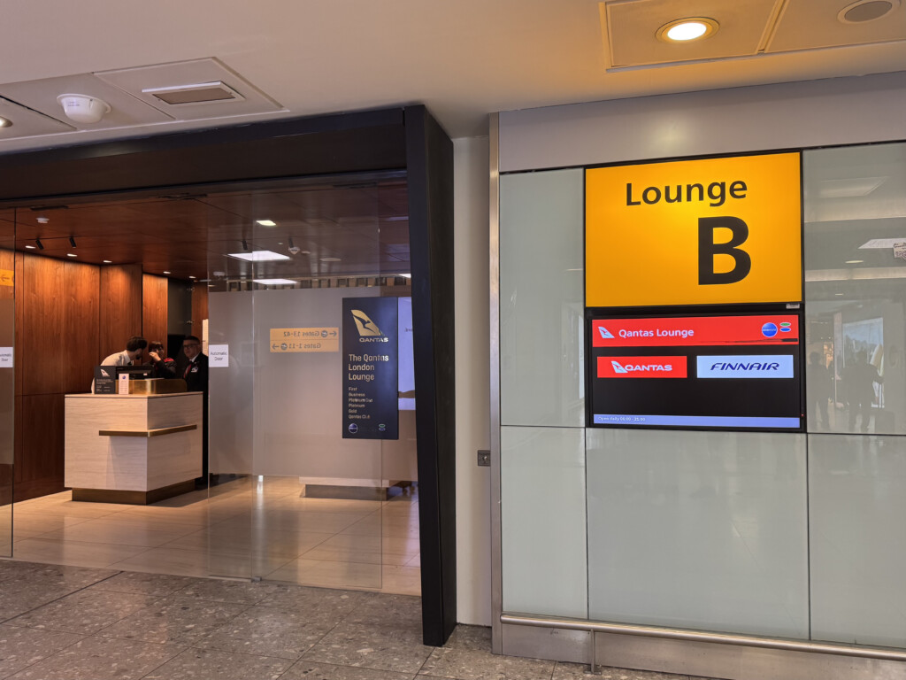 a sign in front of a glass door