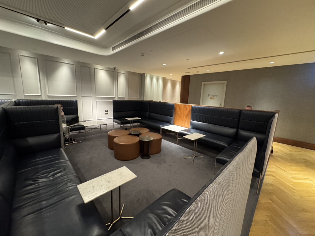 a room with black couches and tables