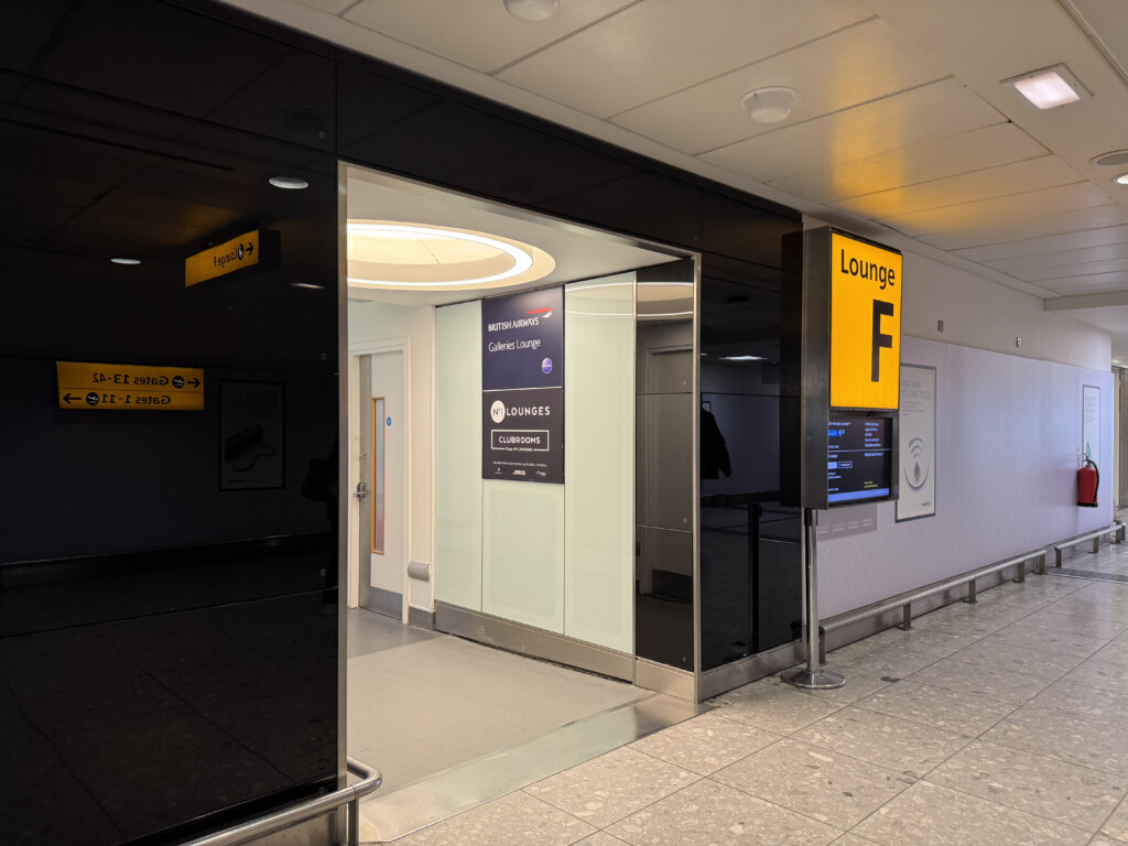 a black and yellow sign in a hallway