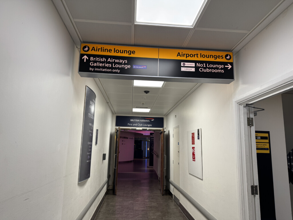 a hallway with signs and a door