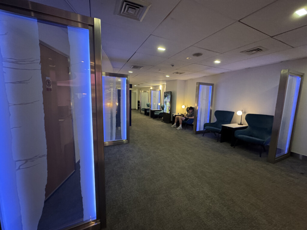 a room with a couple of chairs and a door