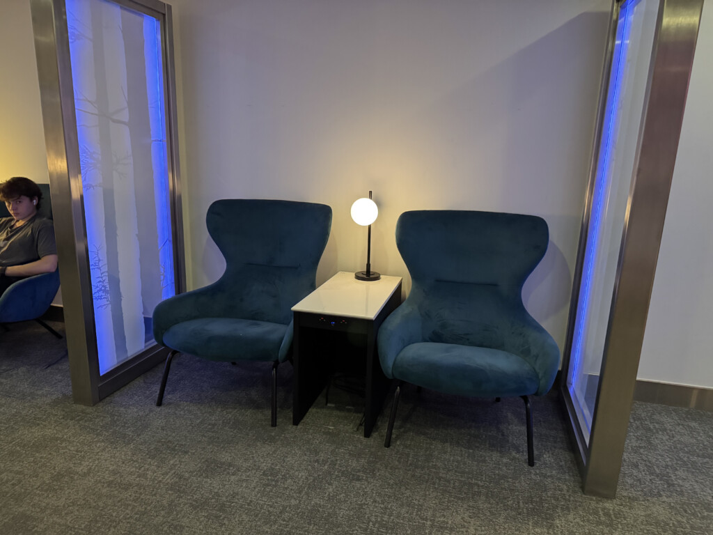 two chairs next to a table