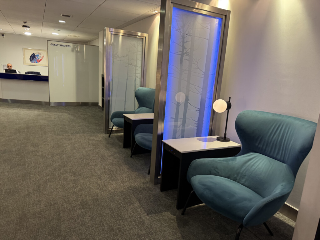 a room with blue chairs and a table