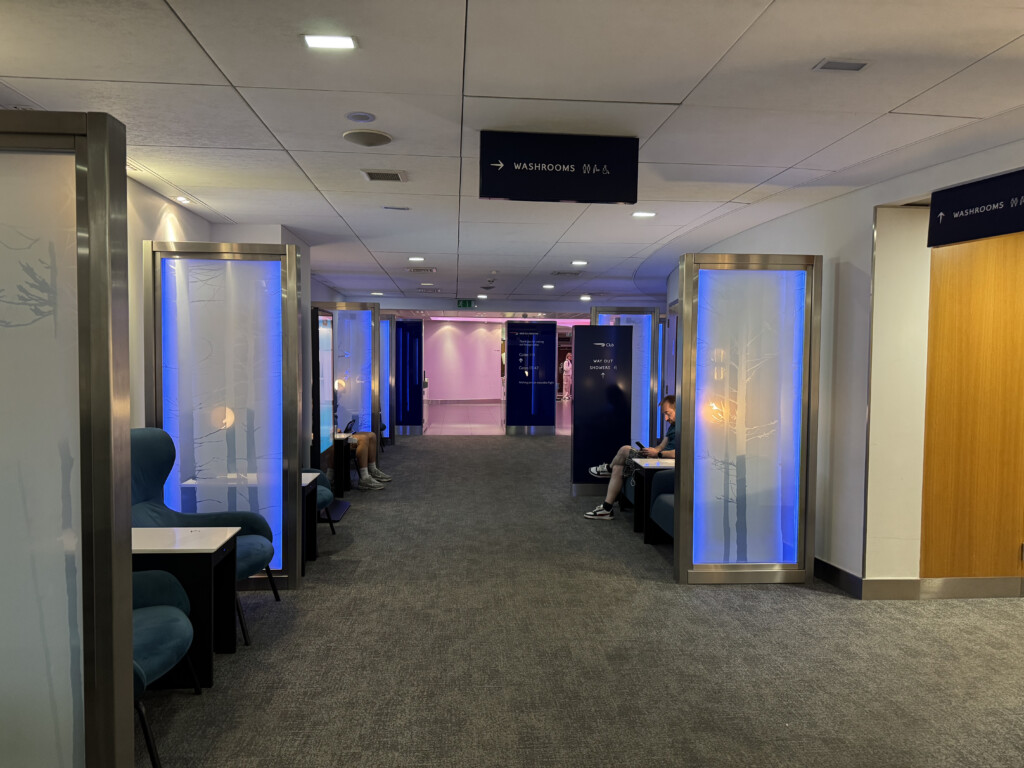 a room with blue lights and chairs
