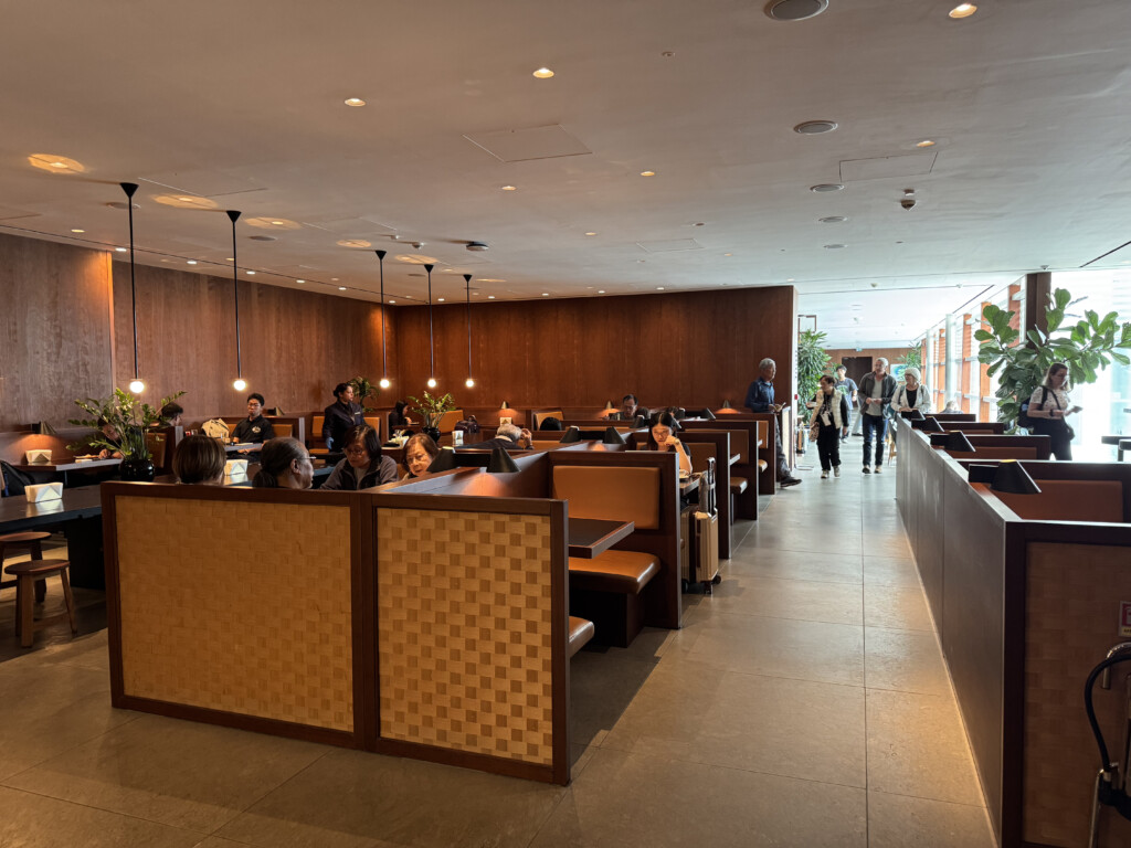 a room with many tables and chairs