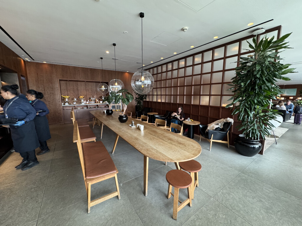 a room with a long table and chairs
