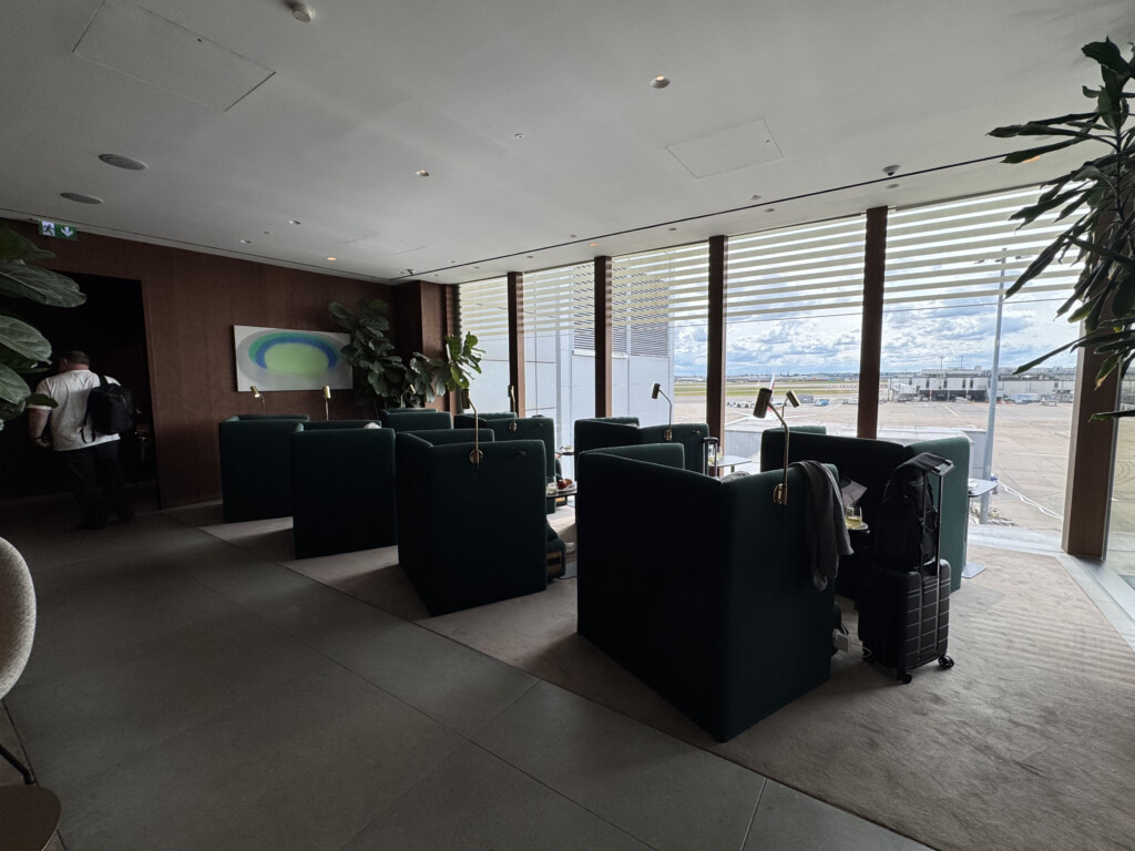 a room with chairs and luggage