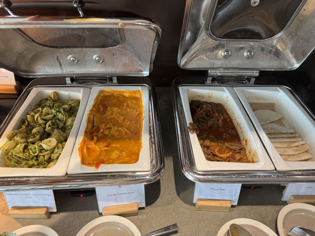 a trays of food in a buffet