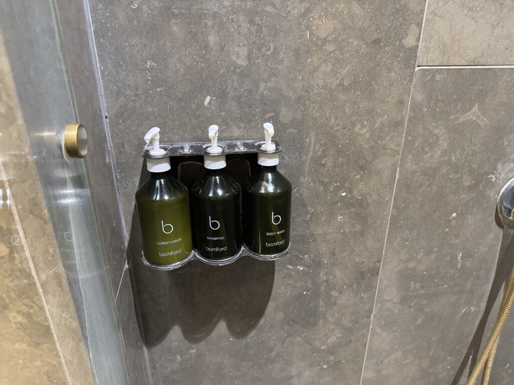 a group of soap dispensers on a wall