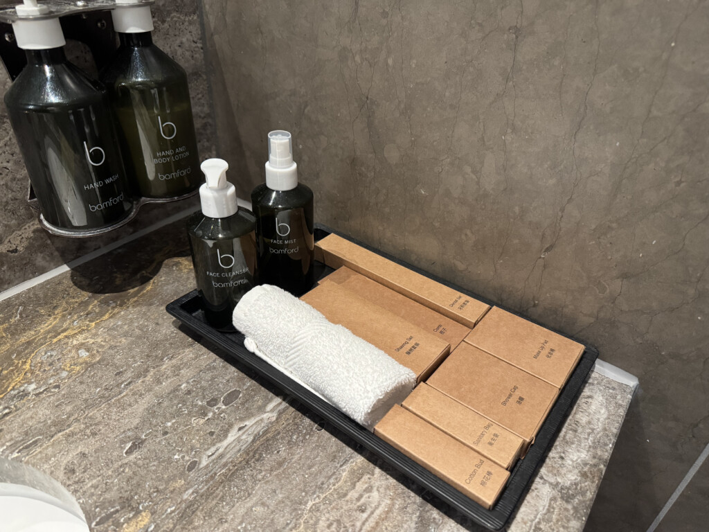 a tray with bottles and a towel on it