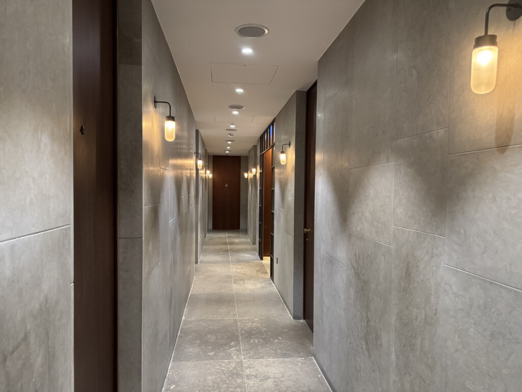 a hallway with doors and lights