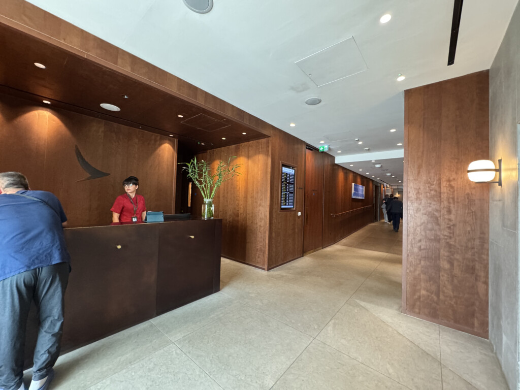 a man standing at a reception desk