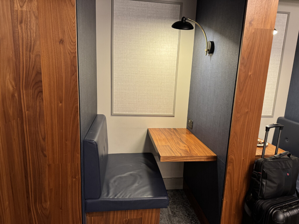 a booth with a table and a lamp