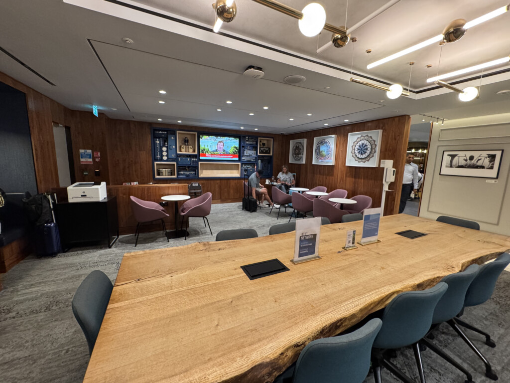 a room with a large table and chairs