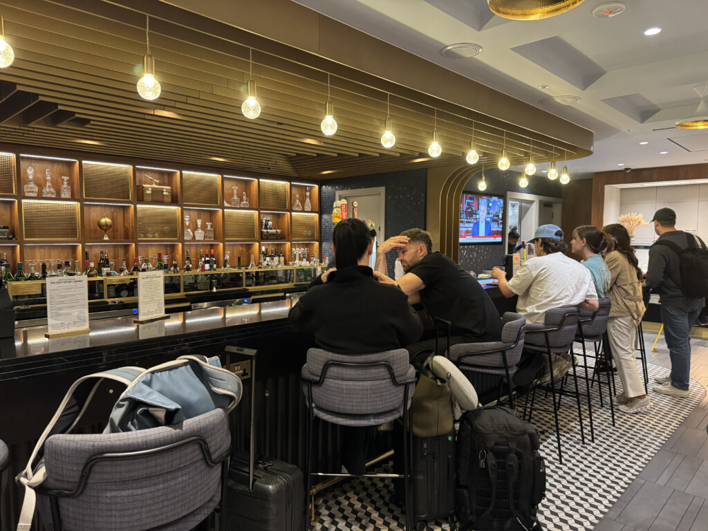 a group of people sitting at a bar