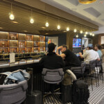 a group of people sitting at a bar