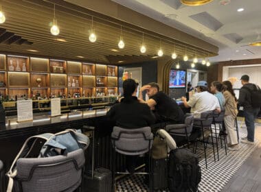 a group of people sitting at a bar