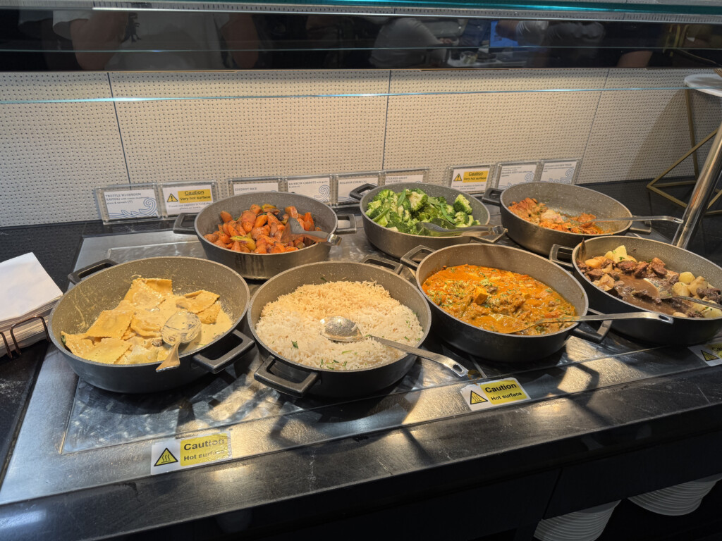 a group of pans with food in them