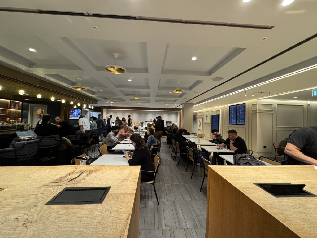 a group of people sitting at tables in a room