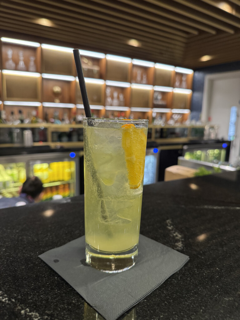 a glass of drink with a straw