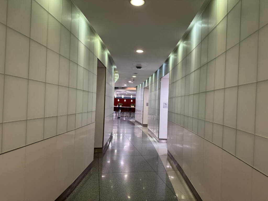 a hallway with white walls and lights