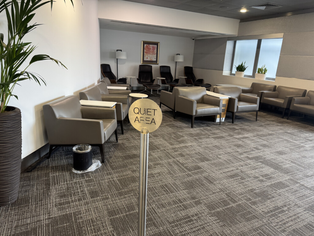 a room with chairs and a sign