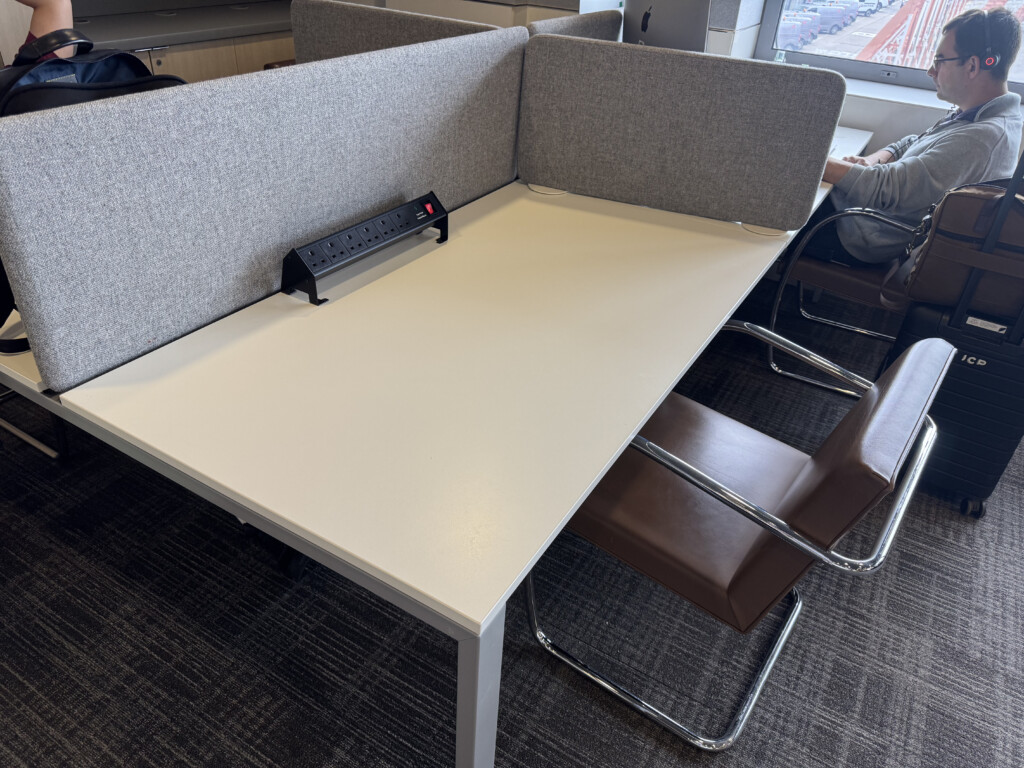 a desk with a black object on it