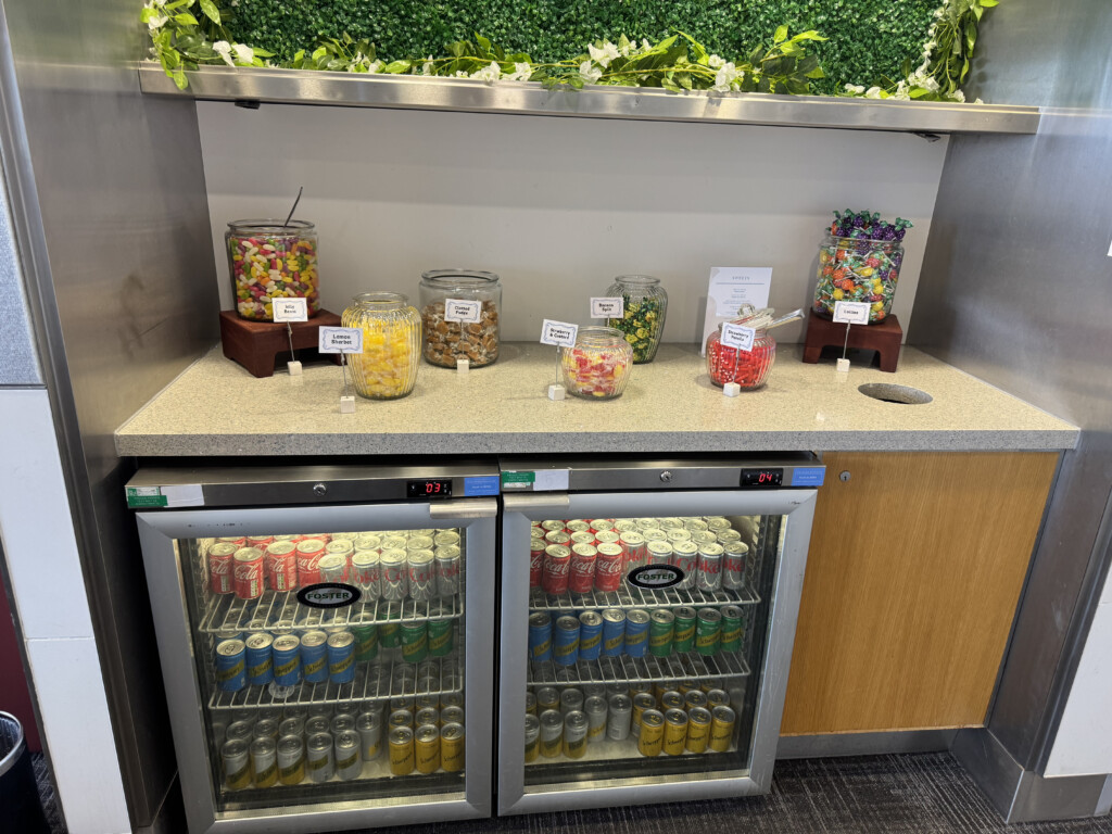 a refrigerated fridge with drinks and candy