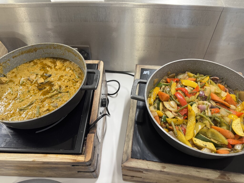 two pots with food in them
