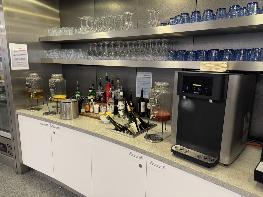 a bar with a variety of glasses and bottles