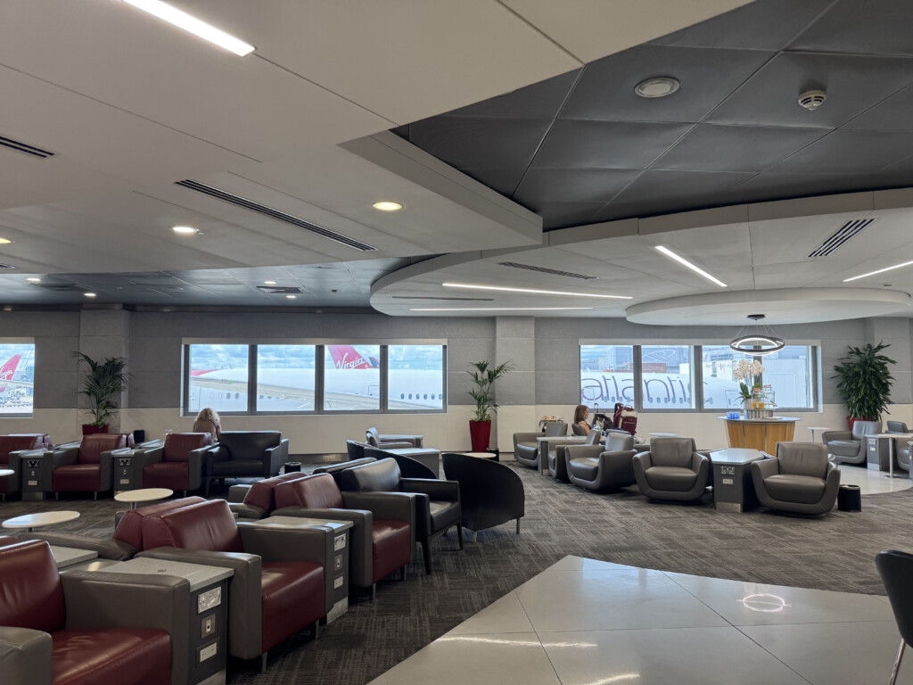 a lounge area with chairs and tables