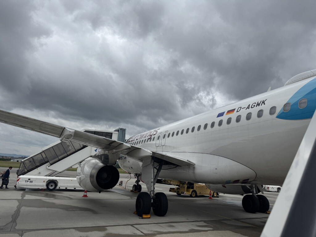 a white airplane with a few wheels on it