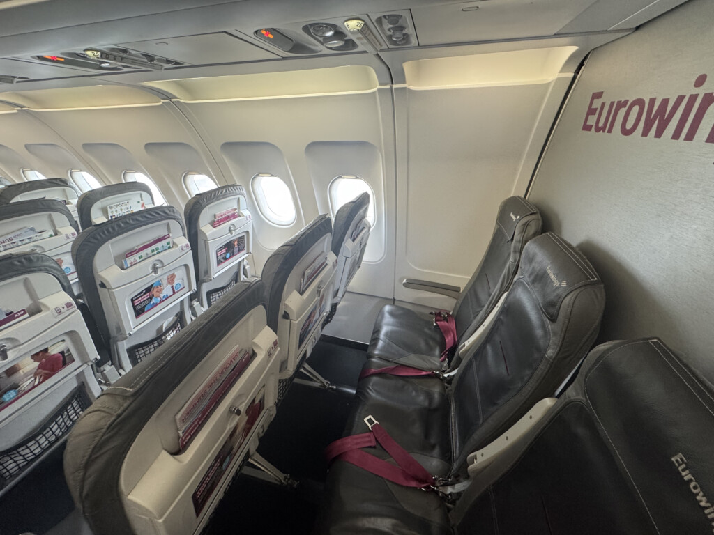 seats in an airplane with windows