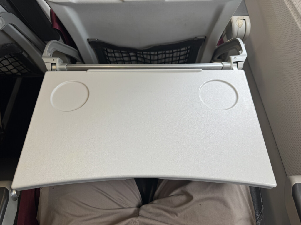 a white plastic table on a person's lap