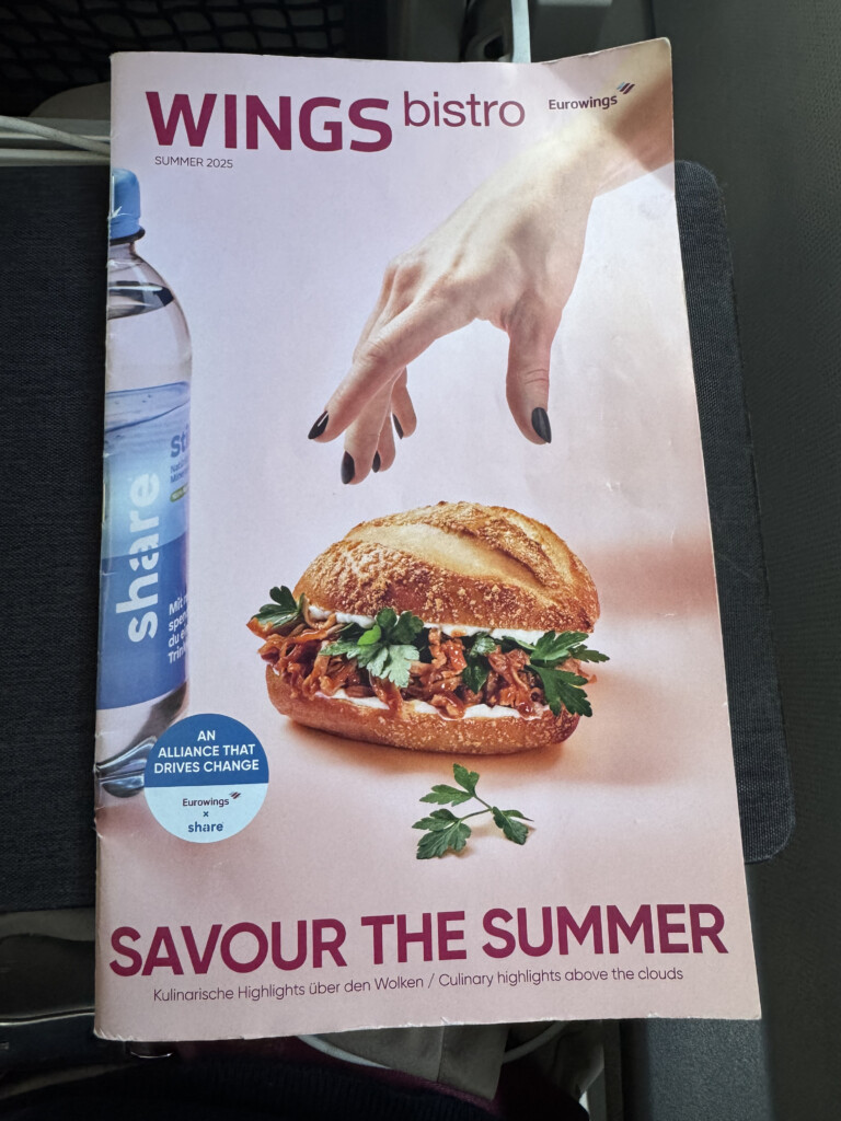 a poster of a sandwich and a hand