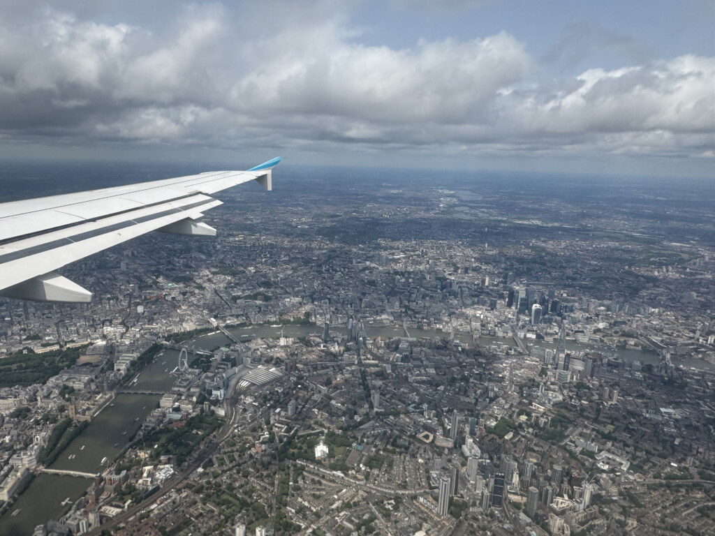 an airplane wing and city view